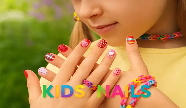 Colorful kids nail designs with playful patterns and multicolored text reading Kids Nails, representing children’s nail services at EcoBeauty Nail Spa in Jacksonville, FL.